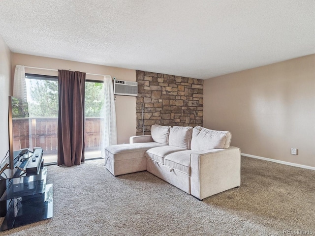381 S Ames St Unit G101, Lakewood, CO 80226 - living area featuring carpet, a textured ceiling, and an AC wall unit