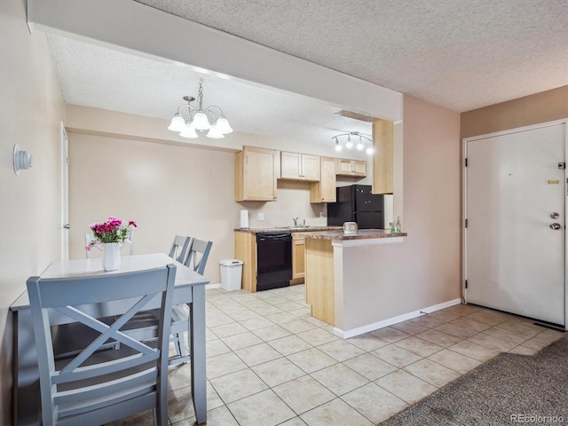 381 S Ames St Unit G101, Lakewood, CO 80226 - kitchen featuring black appliances, light brown cabinets, light tile patterned floors, a textured ceiling, and a peninsula
