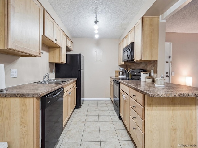 381 S Ames St Unit G101, Lakewood, CO 80226 - kitchen with black appliances, light brown cabinets, a textured ceiling, light tile patterned flooring, and dark countertops
