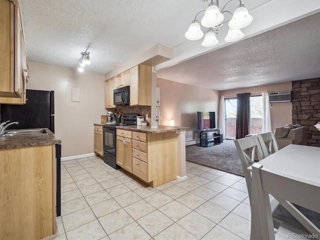 381 S Ames St Unit G101, Lakewood, CO 80226 - kitchen featuring black appliances, open floor plan, dark countertops, and a textured ceiling