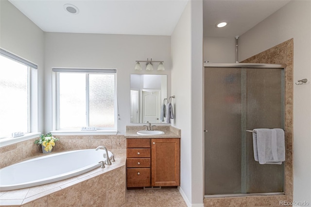 bathroom featuring vanity and plus walk in shower