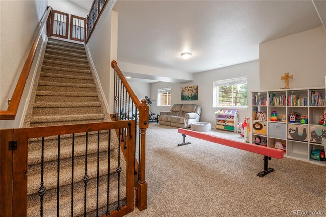 rec room with carpet flooring