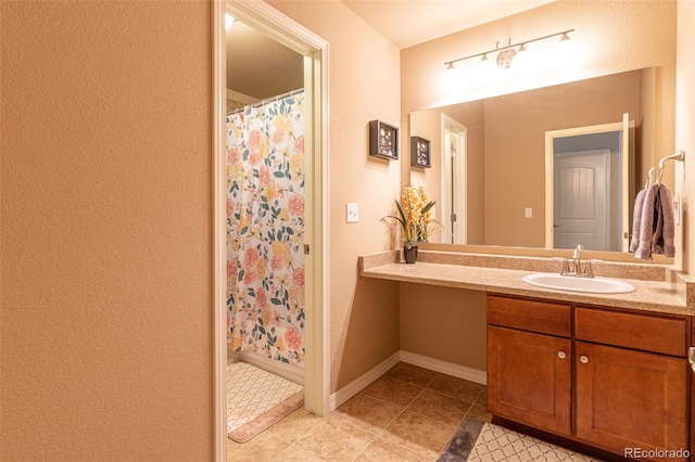 bathroom with vanity and tile patterned floors