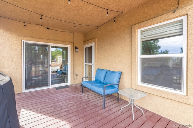 wooden deck featuring outdoor lounge area