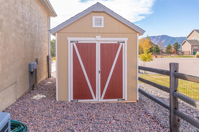 view of outbuilding featuring a mountain view