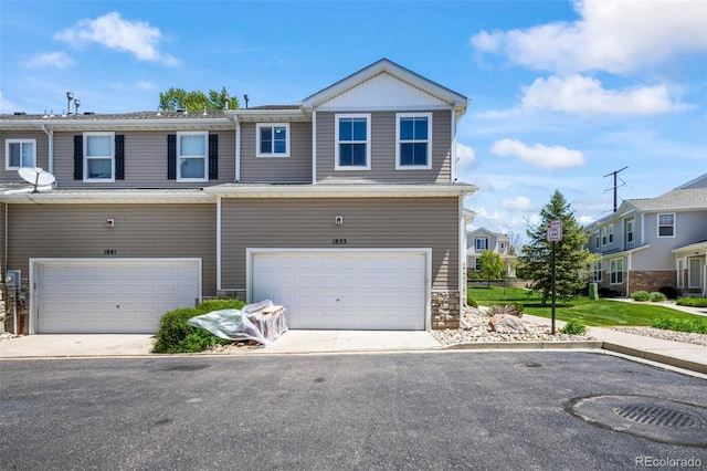 view of front of house featuring an attached garage and driveway