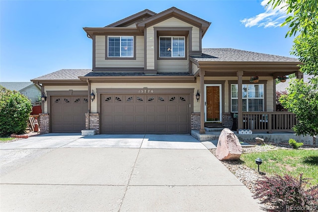 15776 E 107th Way, Commerce City, CO 80022 - view of front of home featuring a porch, driveway, a shingled roof, and a garage