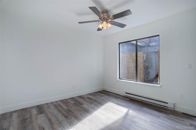 empty room with baseboards, ceiling fan, baseboard heating, and wood finished floors