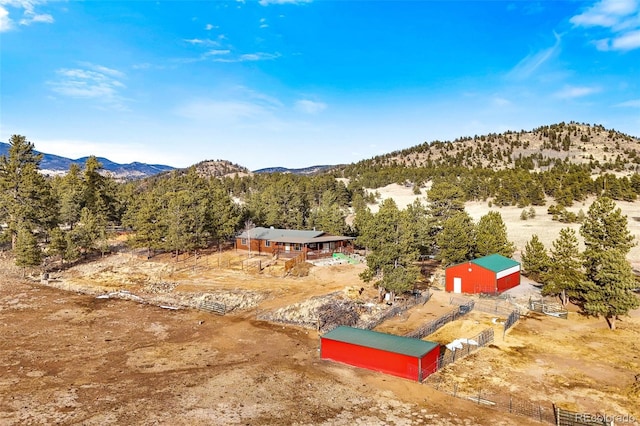 birds eye view of property with a mountain view