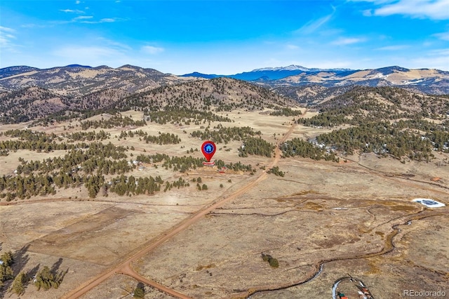 drone / aerial view featuring a mountain view