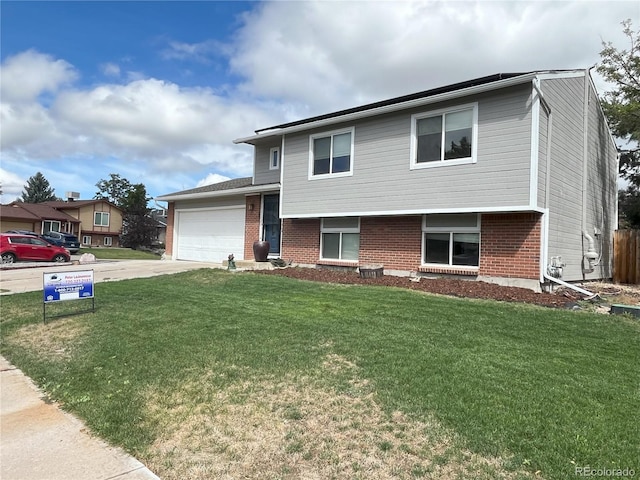 tri-level home with a front lawn and a garage