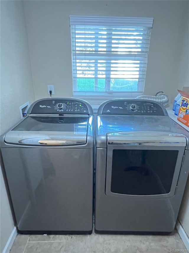 clothes washing area with independent washer and dryer