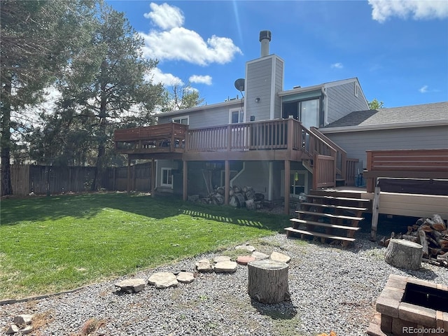 back of property featuring a yard and a deck