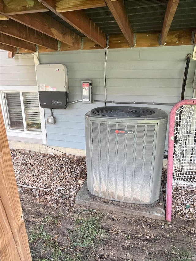 exterior details with central AC and wooden walls