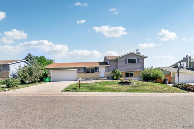 108 Olympus Cir, Lone Tree, CO 80124 - tri-level home with driveway, an attached garage, and a front lawn