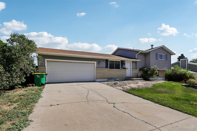 108 Olympus Cir, Lone Tree, CO 80124 - tri-level home with brick siding, concrete driveway, an attached garage, and a front lawn