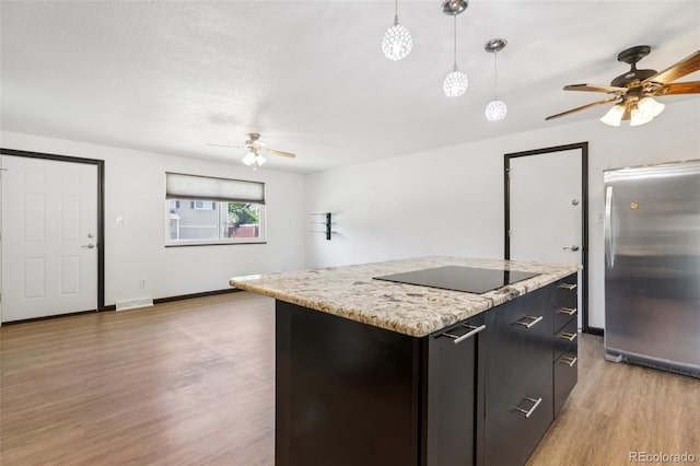 108 Olympus Cir, Lone Tree, CO 80124 - kitchen with freestanding refrigerator, a ceiling fan, black electric cooktop, and light wood-style flooring
