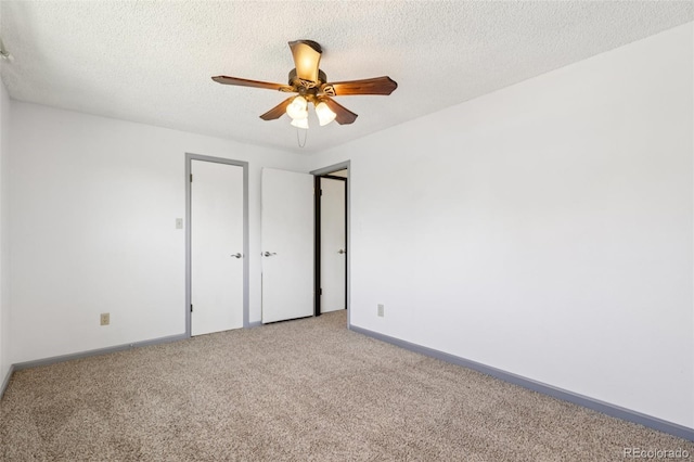 108 Olympus Cir, Lone Tree, CO 80124 - unfurnished bedroom featuring light colored carpet, a textured ceiling, and a ceiling fan
