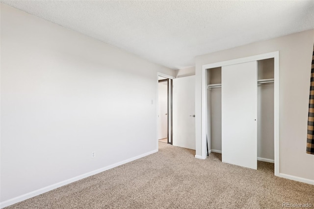 108 Olympus Cir, Lone Tree, CO 80124 - unfurnished bedroom featuring carpet floors, a closet, and a textured ceiling
