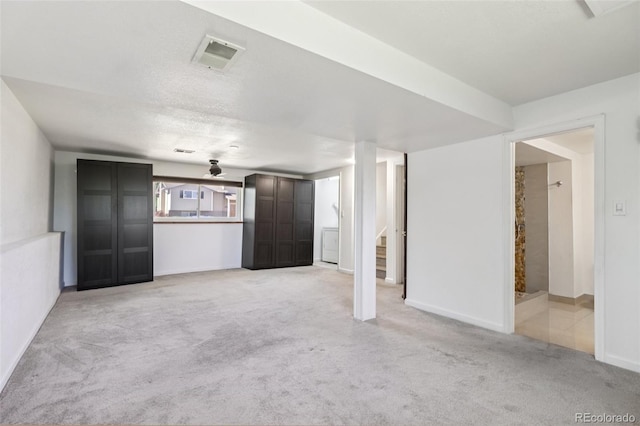 108 Olympus Cir, Lone Tree, CO 80124 - unfurnished living room with light carpet, washer / dryer, and stairs