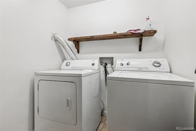 108 Olympus Cir, Lone Tree, CO 80124 - laundry room featuring washer and clothes dryer and light tile patterned floors