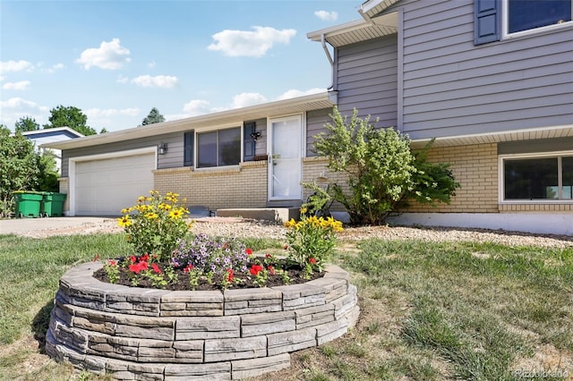 108 Olympus Cir, Lone Tree, CO 80124 - view of front facade with brick siding, a garage, and concrete driveway
