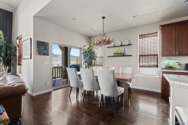 15290 W Baker Ave, Lakewood, CO 80228 - dining space with dark wood-style floors, a chandelier, and recessed lighting
