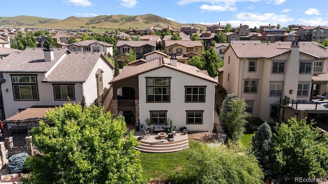 15290 W Baker Ave, Lakewood, CO 80228 - rear view of house featuring a residential view, stucco siding, and a mountain view
