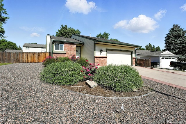5317 S Truckee Ct, Centennial, CO 80015 - ranch-style home with brick siding, an attached garage, concrete driveway, and a chimney