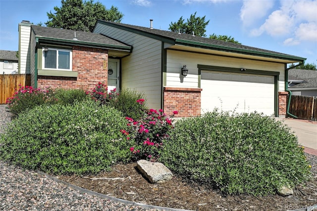 5317 S Truckee Ct, Centennial, CO 80015 - ranch-style home featuring brick siding, a garage, concrete driveway, a chimney, and a shingled roof