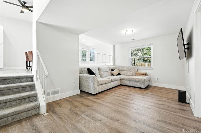 5317 S Truckee Ct, Centennial, CO 80015 - living area featuring ceiling fan, wood finished floors, and stairs
