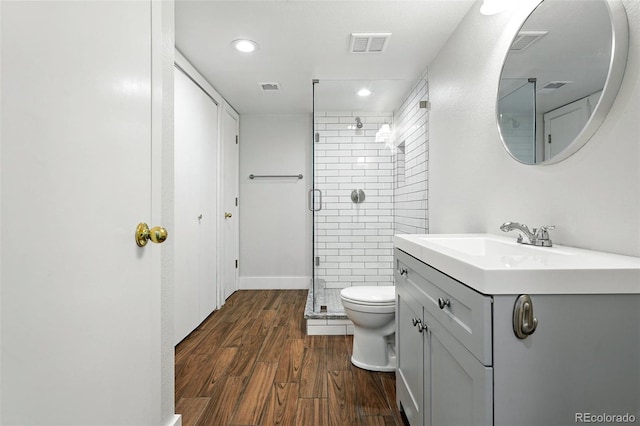 5317 S Truckee Ct, Centennial, CO 80015 - bathroom with a shower stall, vanity, wood finished floors, and recessed lighting