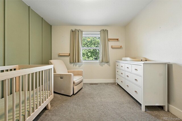 5317 S Truckee Ct, Centennial, CO 80015 - bedroom featuring light colored carpet and a crib