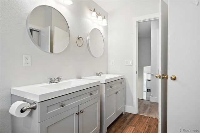 5317 S Truckee Ct, Centennial, CO 80015 - bathroom with wood finished floors and two vanities