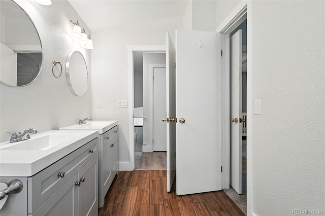 5317 S Truckee Ct, Centennial, CO 80015 - bathroom featuring two vanities and wood finished floors