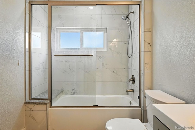 5317 S Truckee Ct, Centennial, CO 80015 - full bathroom featuring a textured wall, enclosed tub / shower combo, and vanity