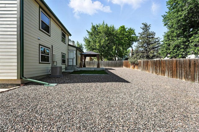 5317 S Truckee Ct, Centennial, CO 80015 - fenced backyard with a gazebo and a patio area