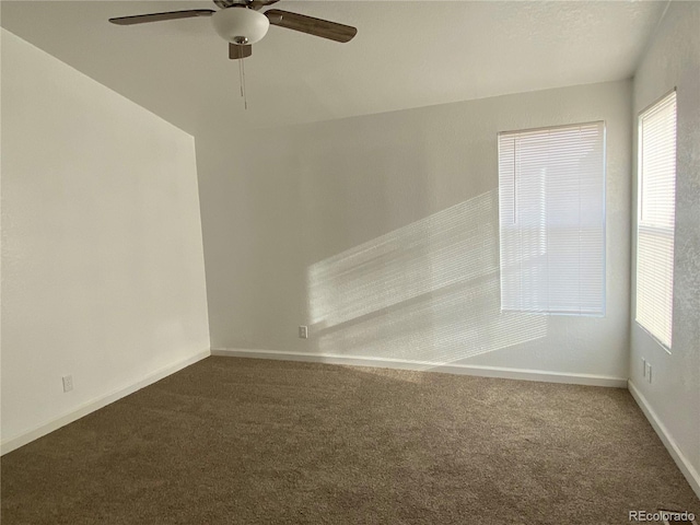 carpeted empty room with ceiling fan