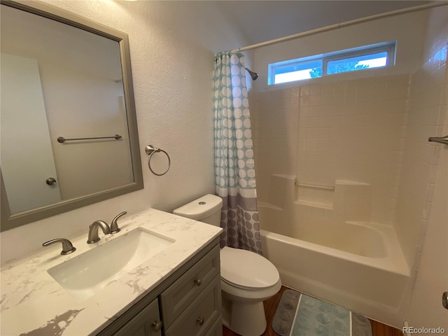 full bathroom with shower / bath combination with curtain, vanity, and toilet