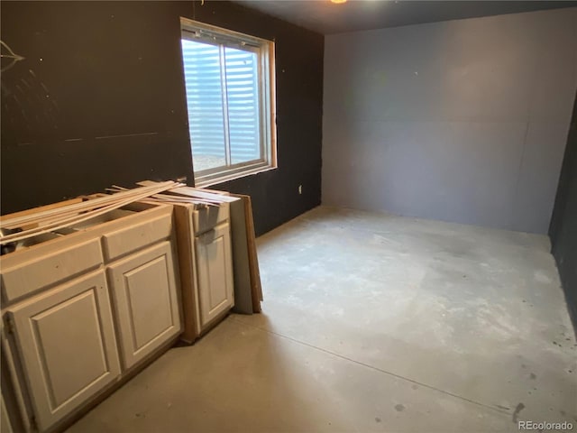 interior space featuring concrete floors