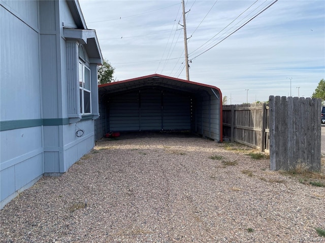 garage featuring a carport