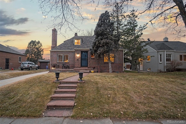 view of front of home with a yard