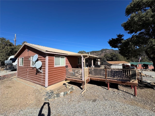 view of front of property with a wooden deck