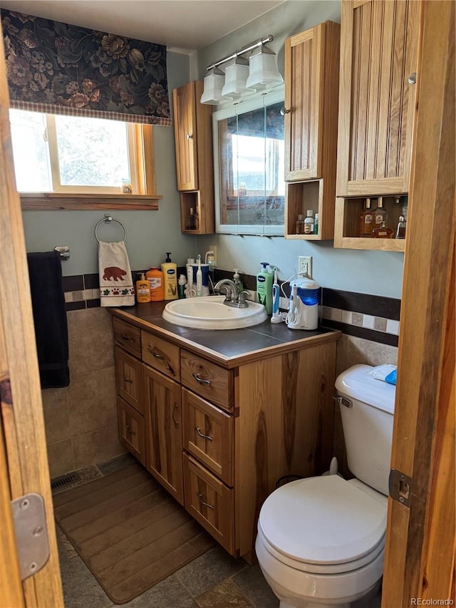 bathroom with vanity and toilet