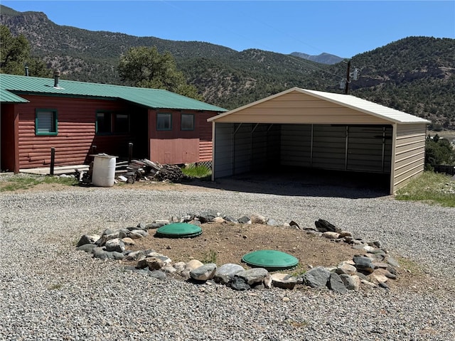 163 Holiday Hills Blvd, Howard, CO 81233 - view of front of house featuring a carport, a mountain view, and driveway