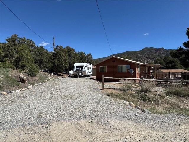 163 Holiday Hills Blvd, Howard, CO 81233 - view of home's exterior featuring a mountain view and fence