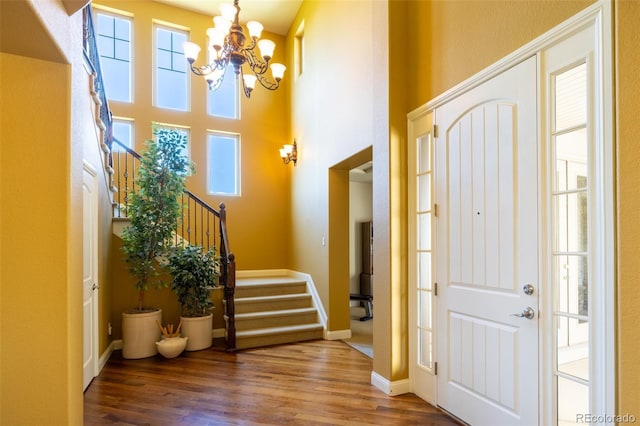 27565 E Nova Pl, Aurora, CO 80016 - entrance foyer with stairway, wood finished floors, and a chandelier