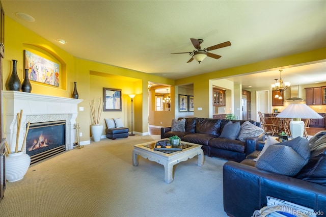 27565 E Nova Pl, Aurora, CO 80016 - carpeted living room featuring ceiling fan, a chandelier, and a tiled fireplace