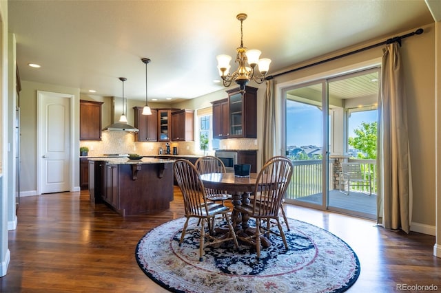 27565 E Nova Pl, Aurora, CO 80016 - dining space with dark wood finished floors, a chandelier, and recessed lighting