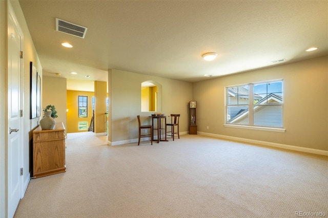 27565 E Nova Pl, Aurora, CO 80016 - spare room with arched walkways, light colored carpet, and recessed lighting